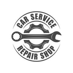 Auto service logotype, wrench and gear silhouette
