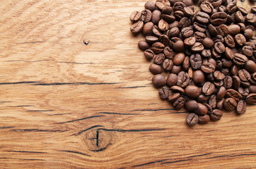 Coffee beans on grunge wooden background