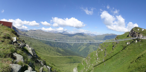 Suspension Bridge, Stubnerkogel, Bad Gastein, Austria. The 140 m long and just one metre wide bridge was built as a swinging rope construction. - obrazy, fototapety, plakaty
