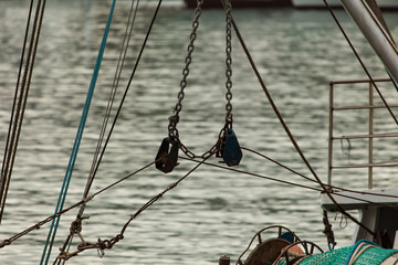 Marine pulleys and mast. Sea background