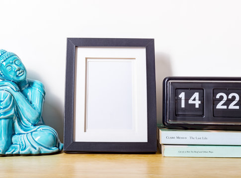 Small picture frame on wooden desk