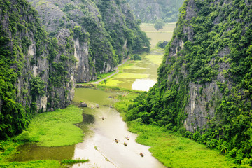 Fototapeta na wymiar Top view of the Ngo Dong River and boats. Ninh Binh, Vietnam