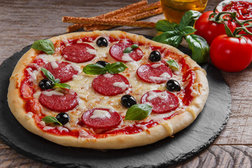 pizza with salami tomato and cheese