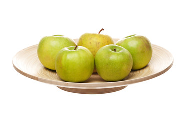 green apples on wooden plate