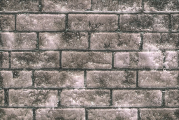 Close up of glossy light brown stone wall with cracks for use a