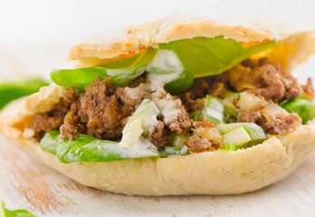 Homemade Pita bread with meat and fresh vegetables.