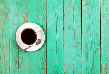 Coffee cup top view on old wooden