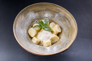 boiled dumplings with cottage cheese on a plate close-up.
