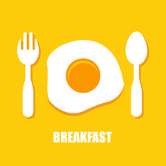 Fried eggs, spoon and fork - breakfast