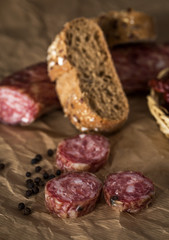 Sausage pieces with bread on paper
