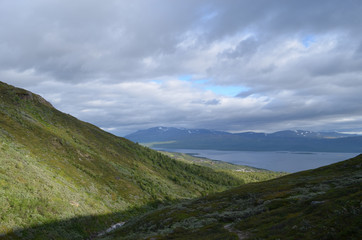 River through valley, mountains and lake Torneträsk, Abisko, subarctic Swedish Lapland