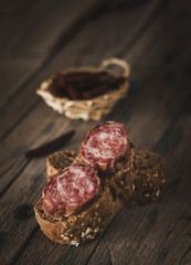 Sausage pieces with bread on paper