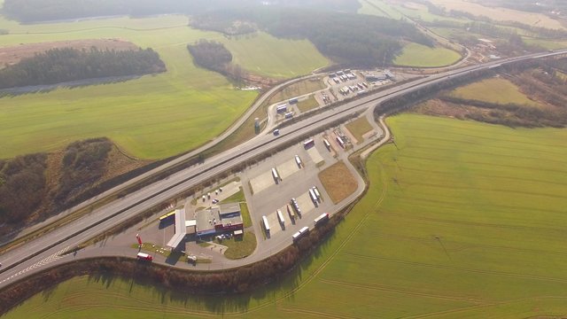 Aerial view of highway D5 gasoline station with parking nearby Pilsen, Czech republic, Central Europe. Transportation concept. 4K UHD video