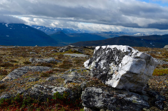 Fototapeta Black and white rocks in alpine tundra, subarctic mountains, Swedish Lapland