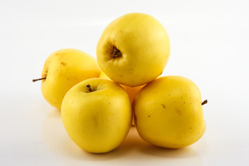 Yellow apples on the white background. Isolated