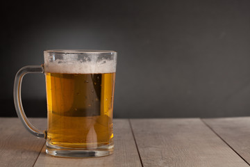 Glass with beer on the table