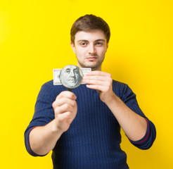 young male dollar magnifying glass