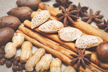 Still life with nuts and spices in a rustic style. Christmas. Vintage style