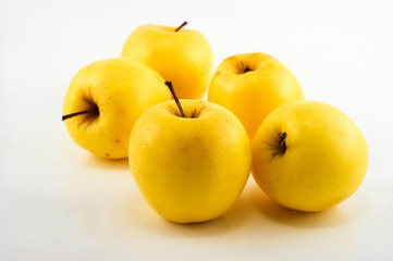 Yellow apples on the white background. Isolated