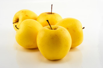 Yellow apples on the white background. Isolated