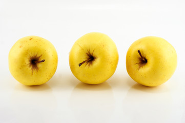 Yellow apples on the white background. Isolated