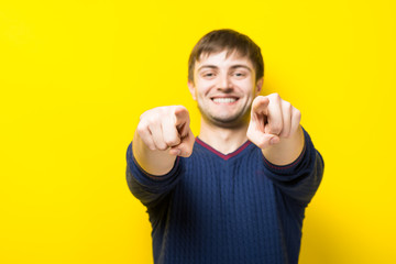 young handsome man showing thumbs up