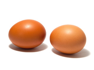 Brown eggs on the white background