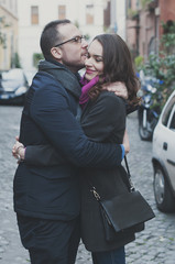 Fototapeta na wymiar Couple in love walking in Rome