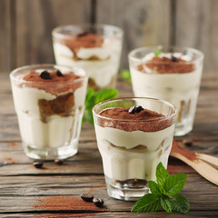 Traditional italian cake tiramisu with cookie and coffee