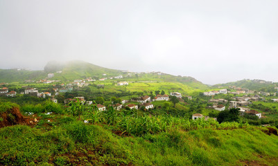 Fototapeta premium Fog engulfed city of Nova Sintra
