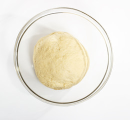 ball of raw dough over white background