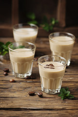 Cold cream with coffe and mint on the wooden table
