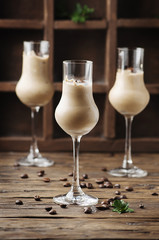 Cold cream with coffe and mint on the wooden table
