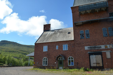 Fototapeta na wymiar Old brick station building in Torneträsk, Swedish subarctic Lapland