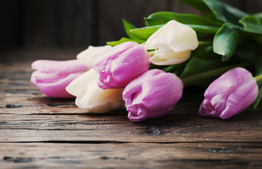 Bouquet of tulips on the wooden table