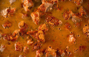 process for preparing meat goulash - pieces of meat and spices filled with water for stew