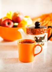 Colorful orange cup of  black tea