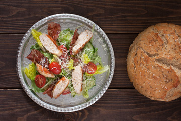 Chicken salad with tomatoes and homemade bread