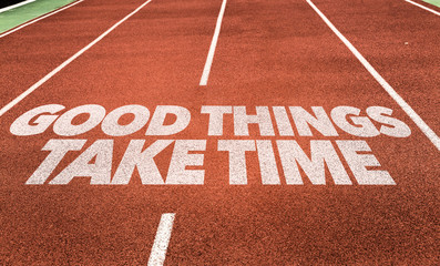 Good Things Take Time written on running track