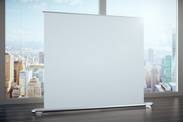 Big blank advertising banner in a room with large windows, mock