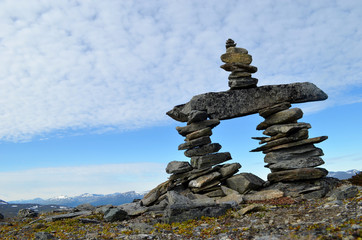 Obraz premium Stone cairn, stone man, trailmark construction on top of a mountain in subarctic Swedish Lapland