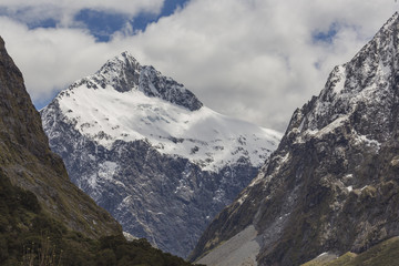 Snow mountains along Milford Sound road New Zealand