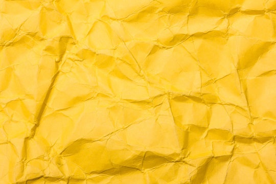 Yellow crumpled paper background.