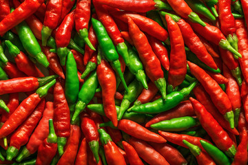 Background image of red and green peppers.
