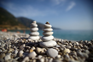 Stacked up pebbles on the beach