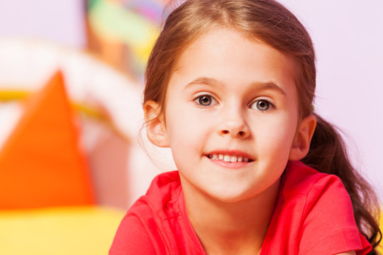 Close Portrait Of Girl With Subtle Smile 