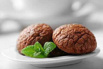 Chocolate chip cookie in plate with mint, closeup