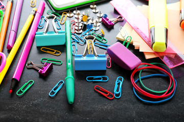 Colourful stationery on black background