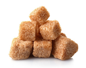 Pile of brown sugar cubes isolated on white background