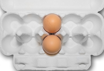 Two eggs in a paper container